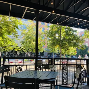 a patio with tables and chairs