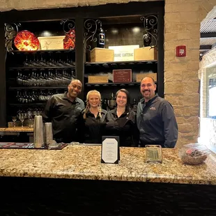 The bar in the Grotto and our amazing service staff for the evening.