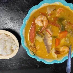 a bowl of soup and a plate of rice