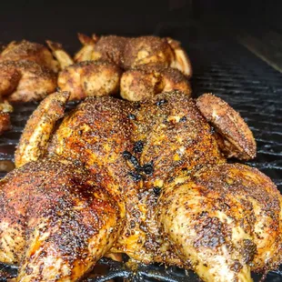 chicken cooking on a grill