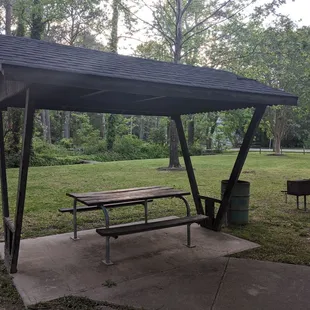 The other of 2 shelters with table and grill