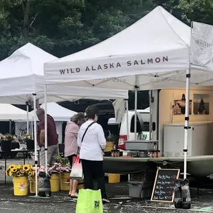 people standing in front of a food truck