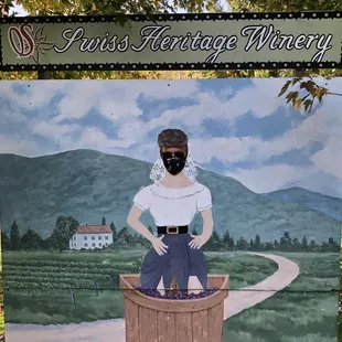 a woman in a wooden barrel