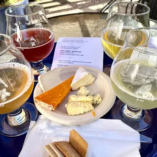 a variety of beers and cheese