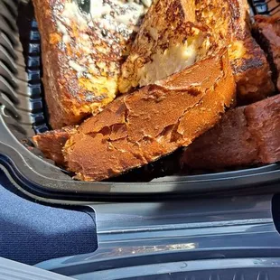 a plate of french toast and a fork