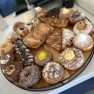 Weekend specials board! Including pumpkin and apple cider donuts with fun toppings/fillings, cronuts, churro bites etc.