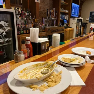 plates of food on a bar