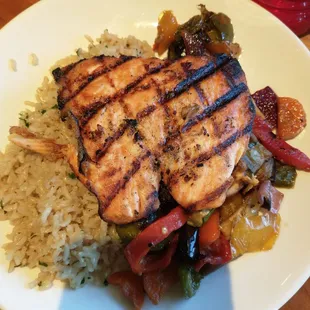 Grilled salmon with rice and root vegetables.