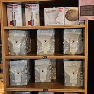 a shelf of coffee roasters