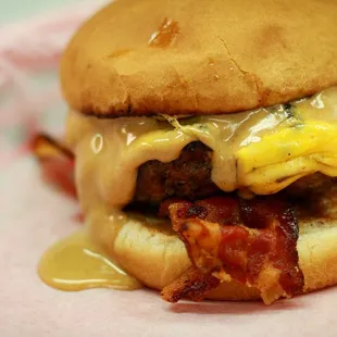 bacon and cheese on a bun