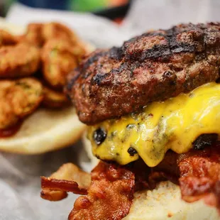 a burger with bacon and cheese