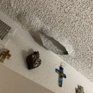 The start of the hole on my ceiling. Was given  2 buckets to &quot;help out&quot;.