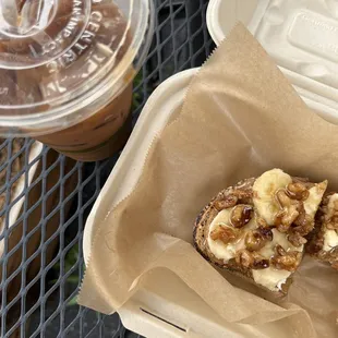 a half eaten sandwich and a cup of coffee