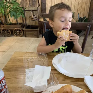 My kid eating Nutella ponchik