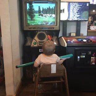 My kid enjoying his first buck hunter game