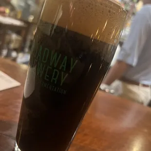 a glass of beer on a table