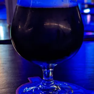 a dark beer in a glass