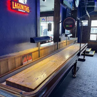 a long wooden shuffle table