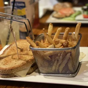 a basket of fries and a sandwich