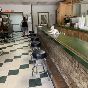 a woman standing at the counter