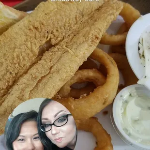 a plate of onion rings and dips