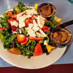 Exotic Salad (Greens, Strawberries, Mangos, Feta, Tomatoes, Onions with Homemade Balsamic) at Broadway Diner