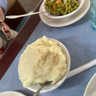 Dinner sides.  Mashed potatoes and peas/carrots.  Huge portions of both. Couldn&apos;t finish everything.