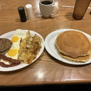 two plates of breakfast food on a table