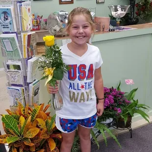 One of our Name of the Day friends that came in for her free flower