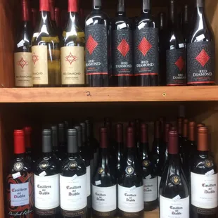 a shelf full of wine bottles