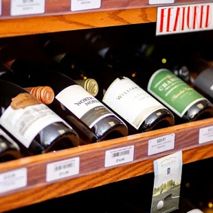 rows of wine bottles on shelves