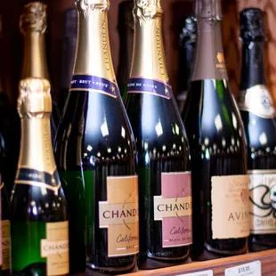 bottles of champagne on a shelf