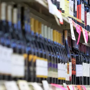 rows of bottles of wine on shelves