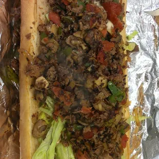 Our succulent steak bomb sandwich, topped with sauteed fresh mushrooms, onions, peppers, and pepperoni