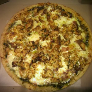 Our succulent chicken pesto pizza, topped with grilled chicken, pesto sauce, bacon, tomatoes &amp; fresh mozzarella