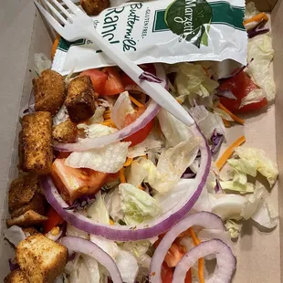 Dinner salad to-go. Browned lettuce and wilted veggies. We didn&apos;t eat this at all.