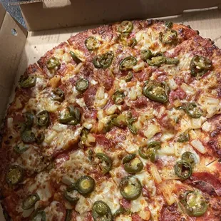 Pepperoni, jalapeño, and pineapple pizza with extra sauce and light cheese. VERY GOOD PIZZA!