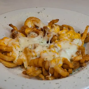 Curly Fries with Creamy Cheddar and Mozzarella Cheese then Baked
