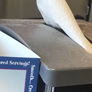 a piece of tissue sitting on top of a toaster