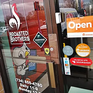 a closed door with stickers on it