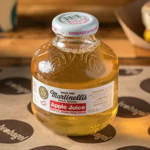 a jar of liquid sitting on a table