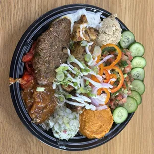 Hubby's bowl with garlic sauce on top. He had regular hummus and spicy hummus .