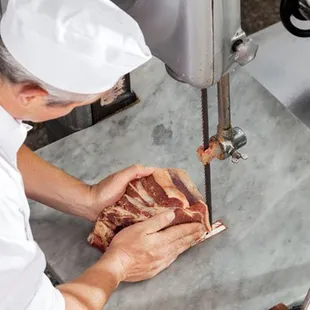 a butcher preparing meat