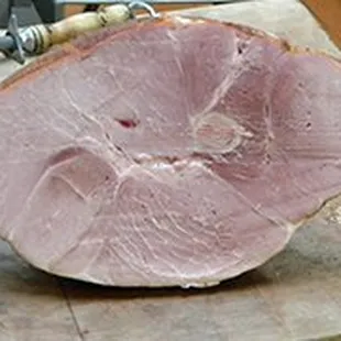 a ham on a cutting board