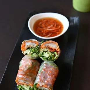 a plate of vegetable spring rolls