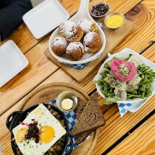 The Spread: Aebleskiver Danish Pancakes (top), pickled herring (middle), Pytt I Panna Sweedish Hash (bottom)