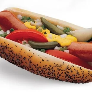a hot dog with pickles and peppers