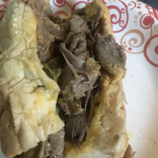 Saturated bun. Cheese sauce thin and watery. Inedible. So wet it was leaking from bag.