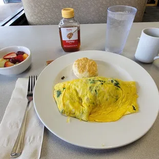 Brisket Omelette - smoked Brisket with Spinach, Onions, Tomatoes and Cheddar Cheese served with fruit and a biscuit. So good.