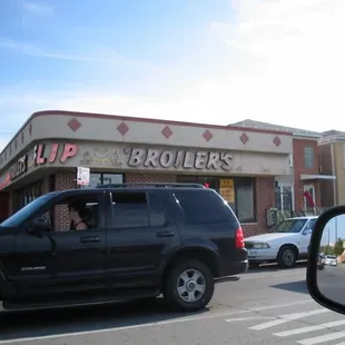 a car in front of a restaurant